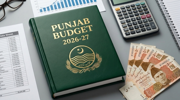 Punjab Budget 2026-27 document placed on a desk alongside Pakistani currency notes, a calculator, a notebook, and financial charts, representing fiscal planning, development allocations, and budget preparation for the province.