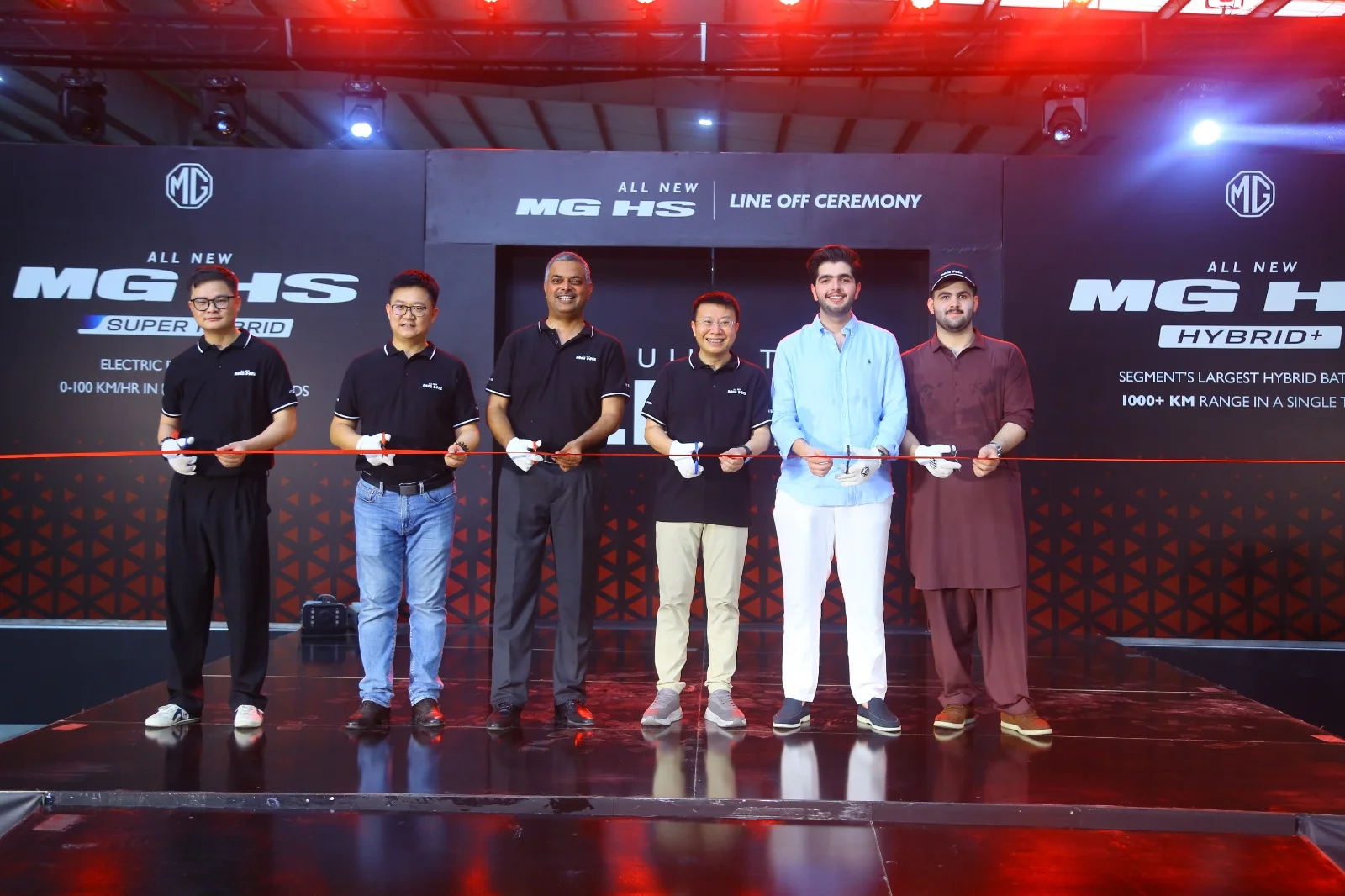 MG Pakistan officials holding a ribbon-cutting ceremony for the CKD line-off of the All New MG HS Hybrid+ and Super Hybrid vehicles.