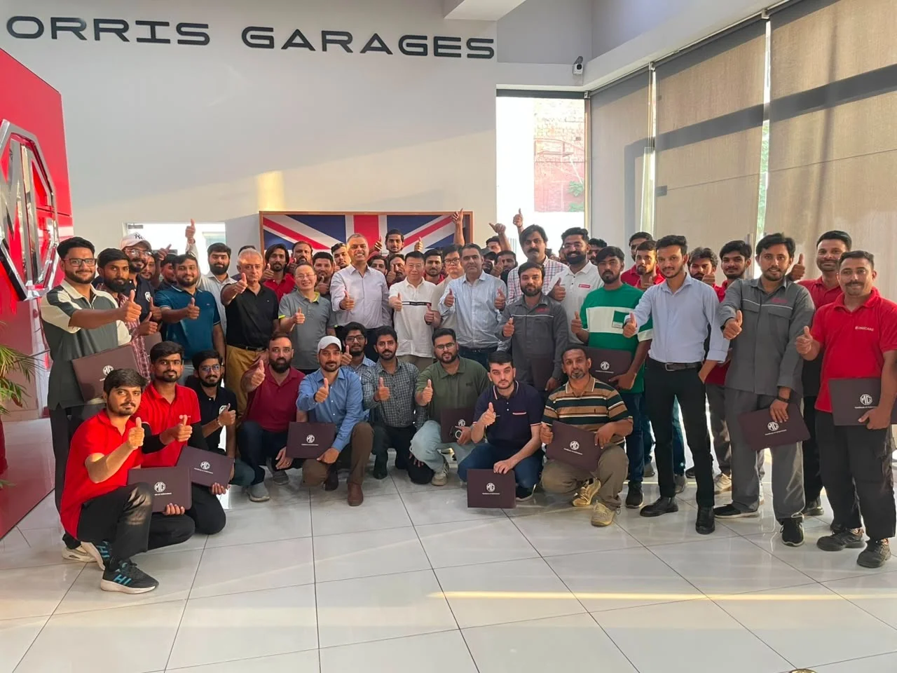 MG Motor Pakistan dealership technicians receiving hands-on hybrid vehicle battery training as part of nationwide after-sales readiness for MG HS Hybrid+ and MG HS Super Hybrid.